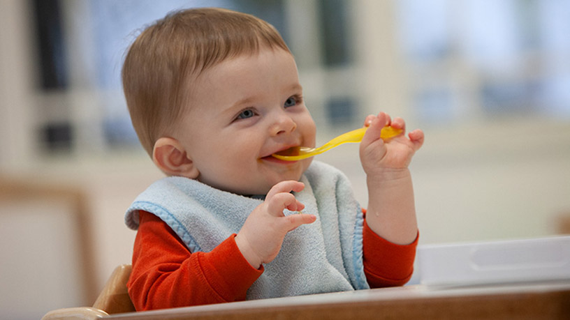 Two young children smiling